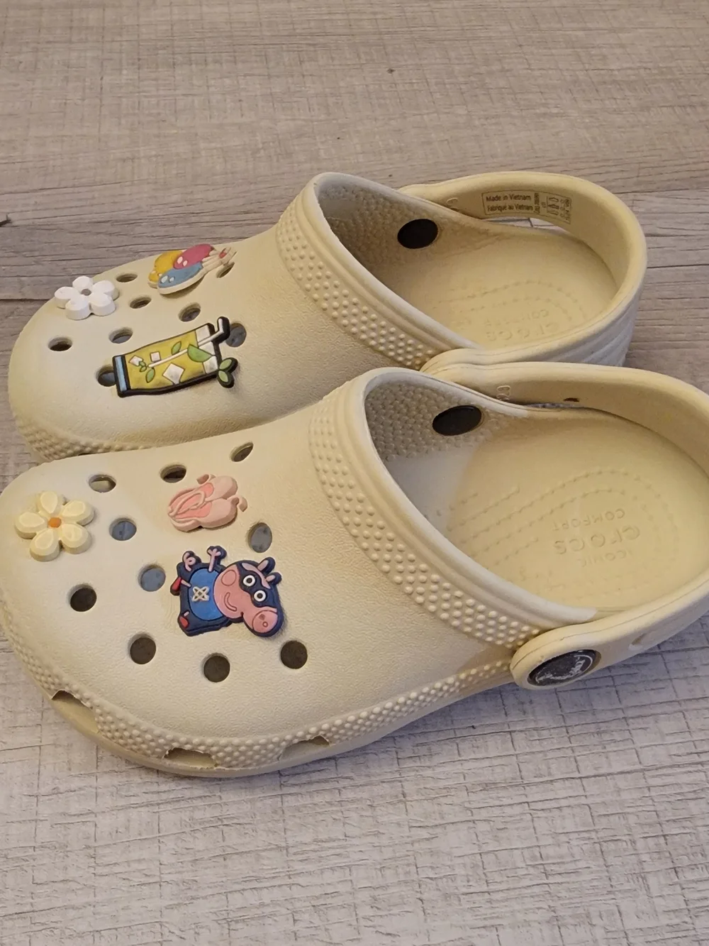 CROCS Kids Cream Slip-On Clogs with Fun Charms